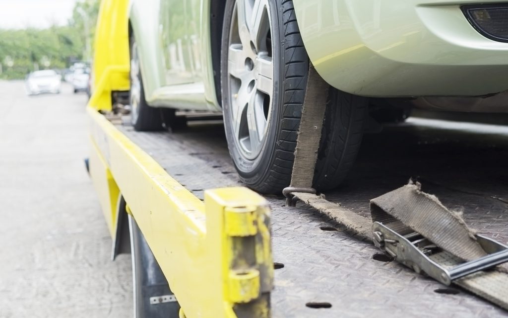 car-transporter-breakdown-lorry-working-using-locked-belt-transport-other-green-car